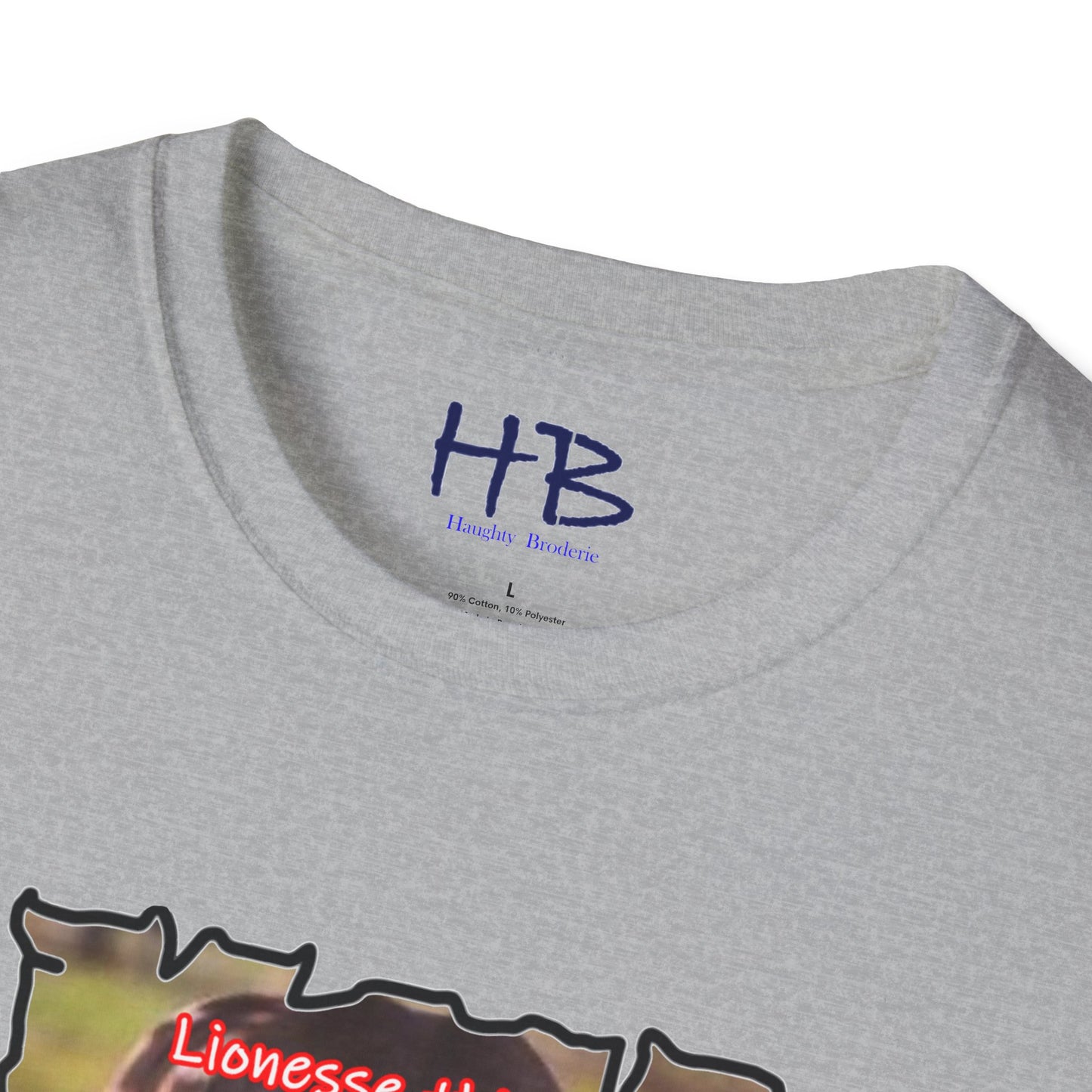 Stealthy Guardian: A Lioness's Hidden Presence Behind Baby Cub