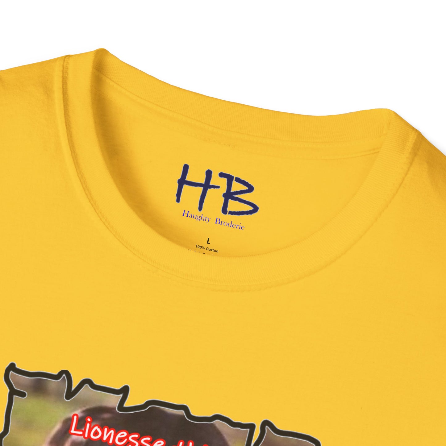 Stealthy Guardian: A Lioness's Hidden Presence Behind Baby Cub