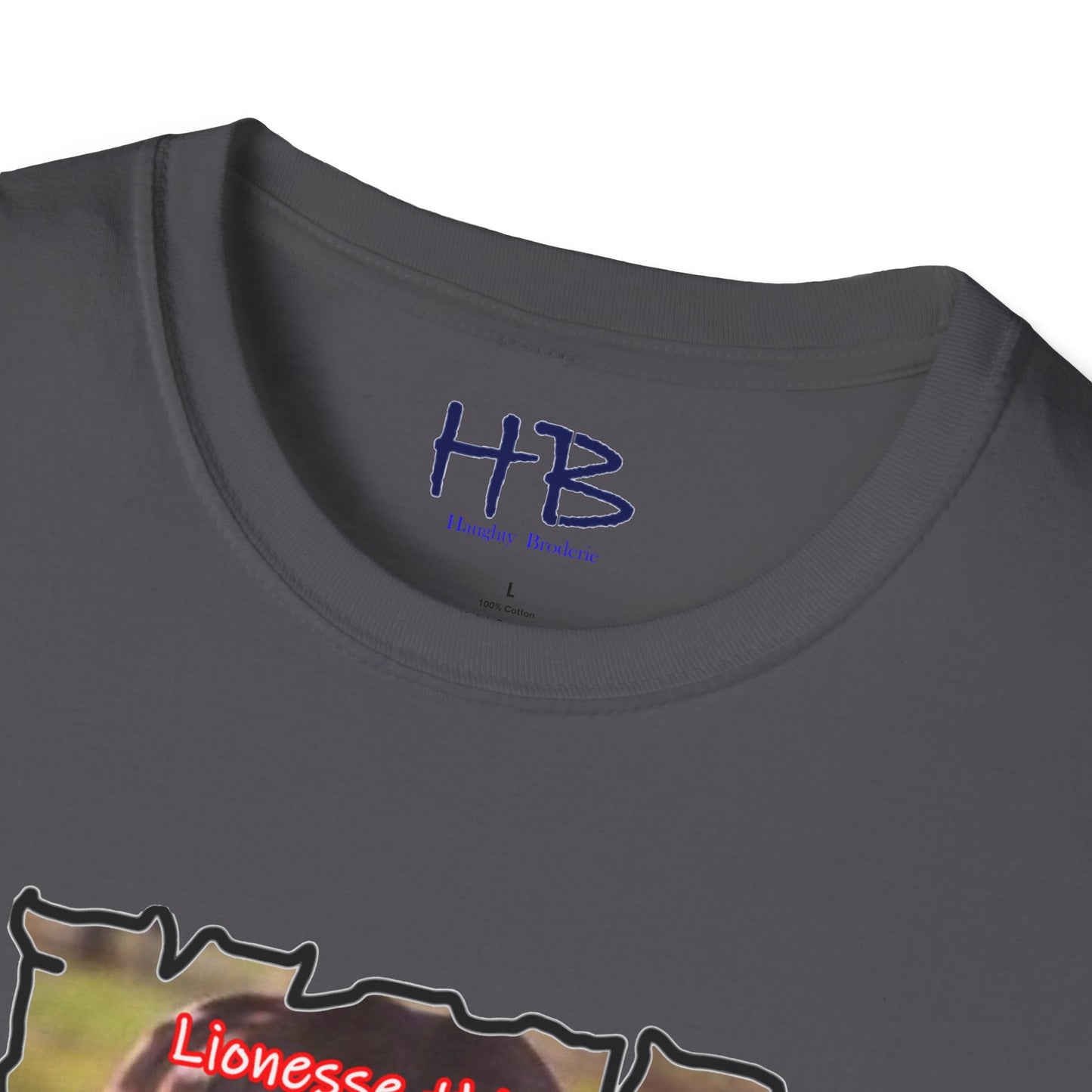 Stealthy Guardian: A Lioness's Hidden Presence Behind Baby Cub