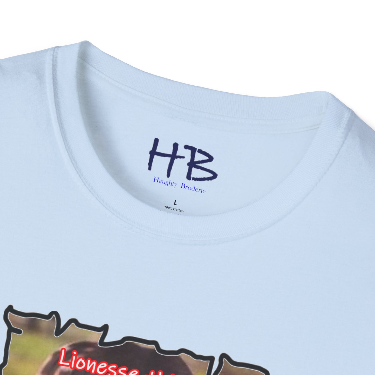 Stealthy Guardian: A Lioness's Hidden Presence Behind Baby Cub