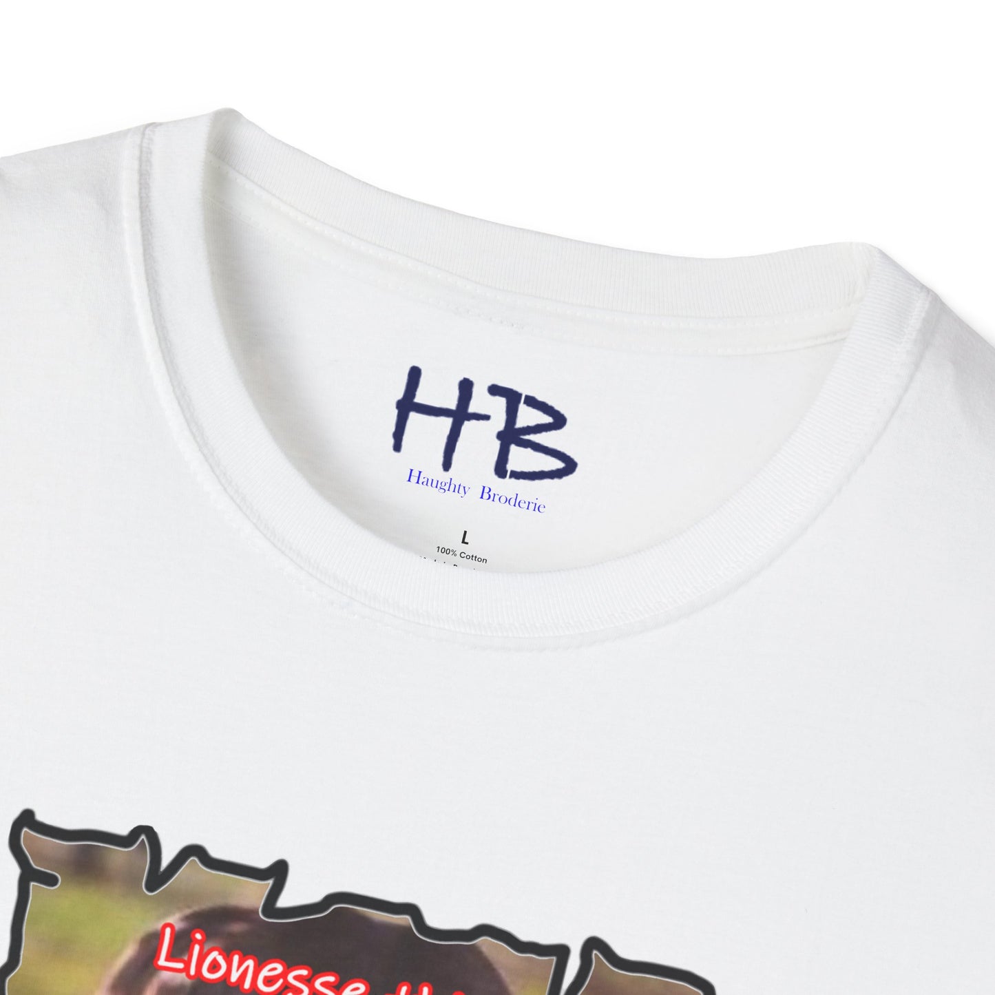 Stealthy Guardian: A Lioness's Hidden Presence Behind Baby Cub