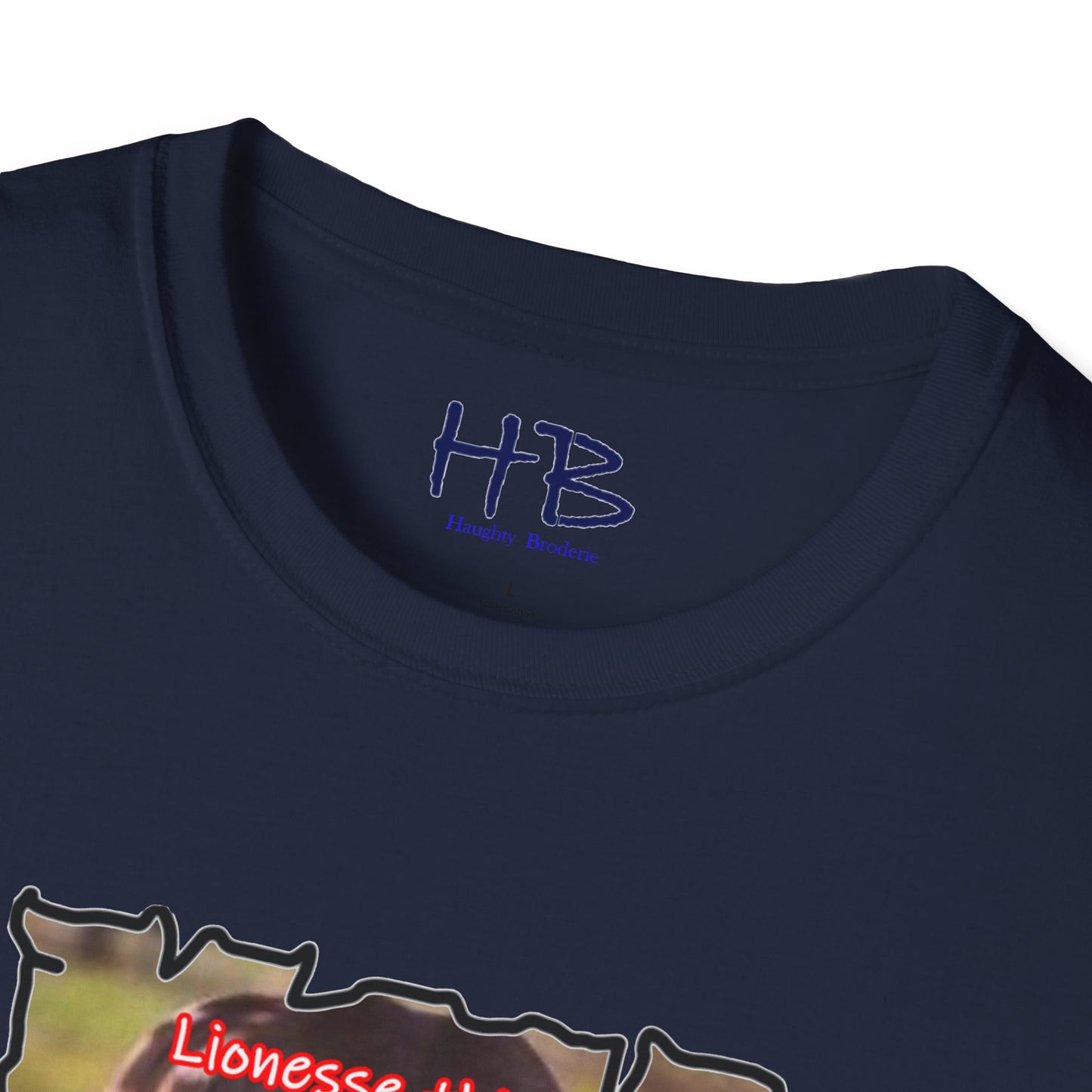 Stealthy Guardian: A Lioness's Hidden Presence Behind Baby Cub